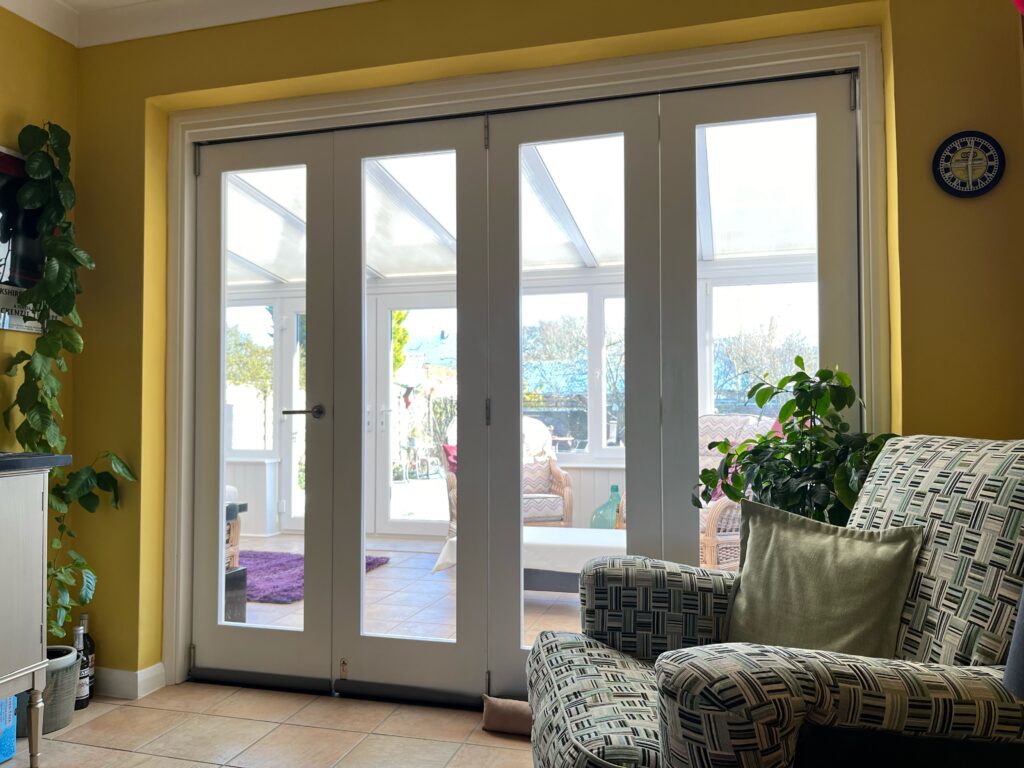 A customer image of a four panel white bifold door.